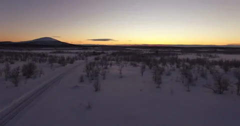 Frozen Road In the Middle Of Nowhere After Sunset, Flyover Stock-Footage 61150700