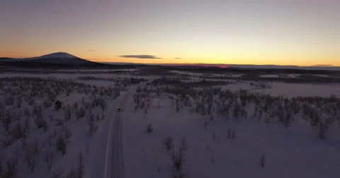 Frozen Road In the Middle Of Nowhere After Sunset, Flyover Stock Footage 61151961