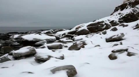 Frozen rocks in ocean cove Stock Footage 34008844