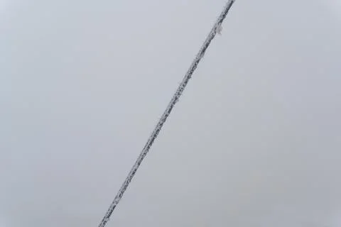 A frozen rope with icicles from the cold, a winter blizzard in the form of ice Stock Photos
