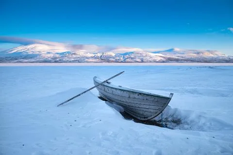Frozen rowing boat Stock Photos