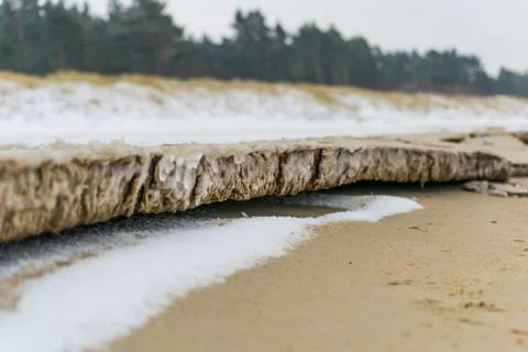Frozen sand on beach Stock Photos