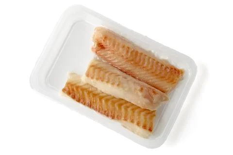 Frozen sea cod fish in vacuum packing isolated on white background. top vie.. Stock Photos