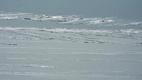 Frozen Sea Ice Surface with Cracks and Raised Ice Close Up 스톡 동영상 326377613