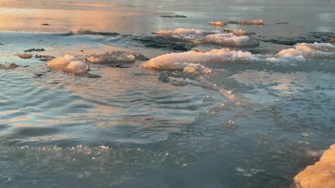 Frozen sea surface with drifting ice and gentle winter waves Stock Footage 328611257