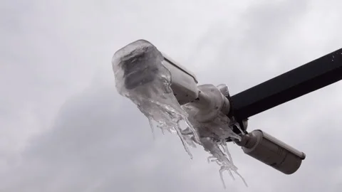 Frozen security camera covered with thick ice after night storm Stock-Footage 321239317