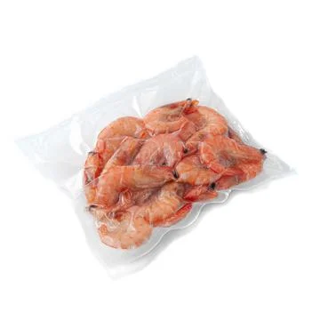 Frozen shrimp. In plastic packaging. White background. Isolated. Foto stock