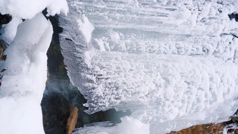 Frozen small waterfall. Winter landscape concept. Ice-covered waterfall. Stock Footage 146336136