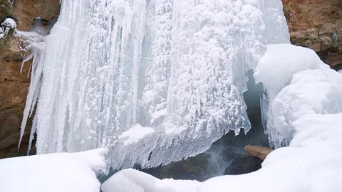 Frozen small waterfall. Winter landscape concept. Ice-covered waterfall. Video stock 147961136