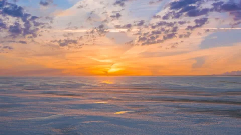 Frozen snowbound lake at the sunset time lapse scene Stock Footage 221573333