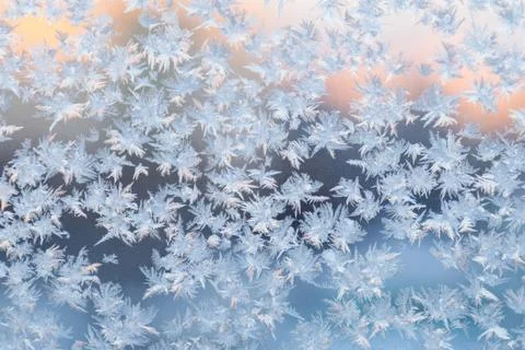 Frozen snowflakes on the window, winter background Stock Photos
