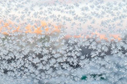 Frozen snowflakes on the window, winter background Stock Photos