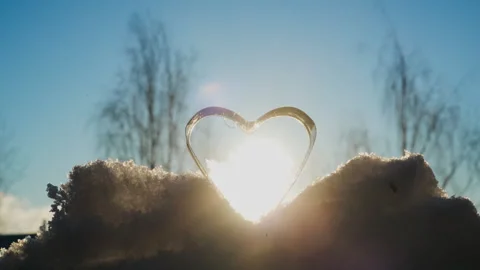 Frozen Soap Heart Crystallizing on Snow in Subzero Winter Conditions Stock Footage 331166044