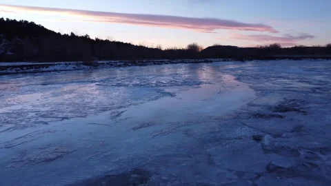 Frozen solid river at dusk Stock-Footage 310571192