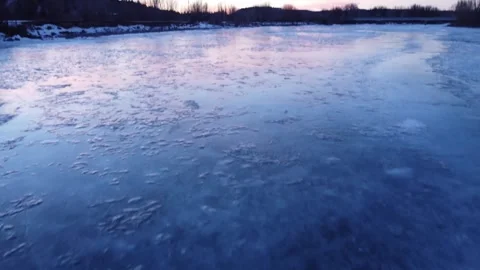 Frozen solid water at sunset, fly over Stock Footage 310576556