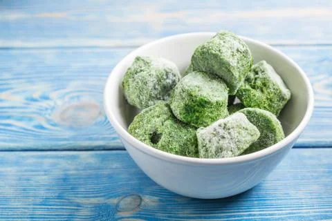 Frozen spinach blocks. Stock Photos