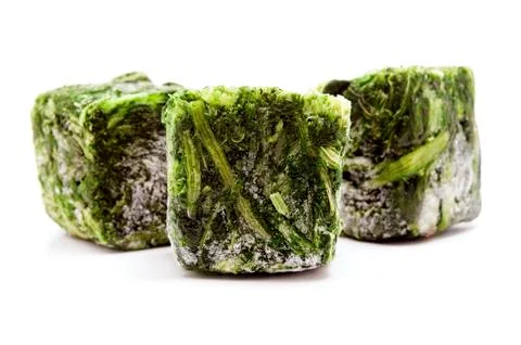 Frozen spinach cubes Stock Photos