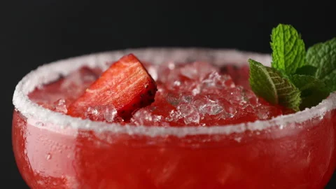 Frozen strawberry lime mint margarita close up Stock Footage