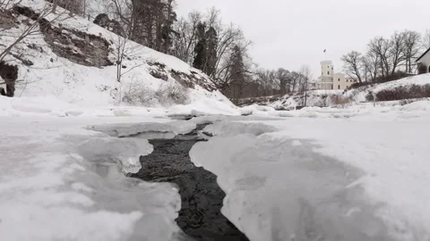 Frozen-stream-leading-to-keila-joa-castle-winter-estonia-4k.mp4 Stock Footage 330007784
