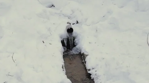 Frozen Stream with Snowy Ice Formation in Nature Stock Footage 328414983