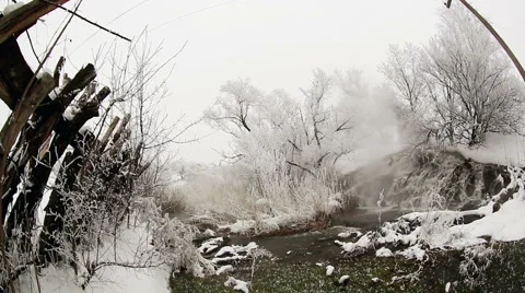 Frozen stream with waterfall and icicles in the winter, Novorossia. Full HD Stock Footage 41895726