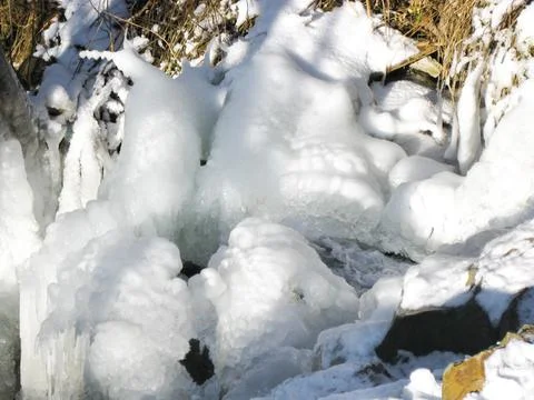 Frozen stream in winter mountains 스톡 사진
