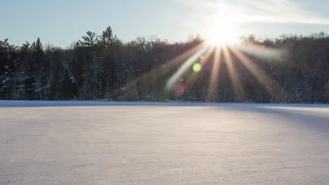 Frozen sunset windy lake Stock Footage 72952501