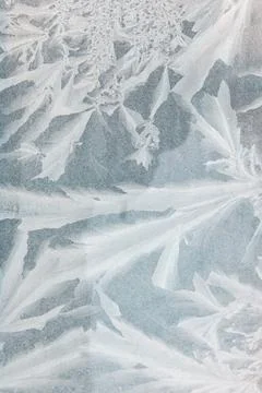 Frozen surface shows intricate ice patterns Stock Photos