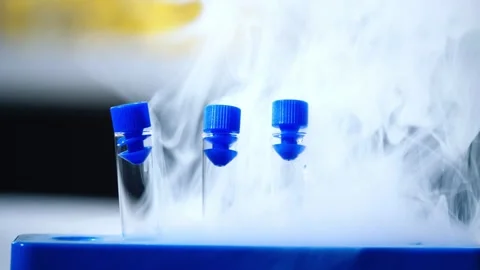 Frozen testing sample of liquid in test tubes Stock Footage 310942199