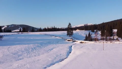 Frozen Tranquility: Aerial Glide Over Wintry Landscape Video stock 224773405