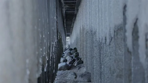 Frozen Under Pier Passage With Icicles And Stones Видео 328100713