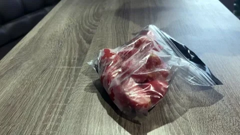 Frozen vegetables are placed on the table. Freezing tomatoes and sugar beets Stock Footage 302098959