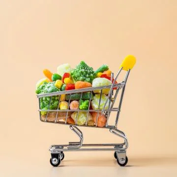 Frozen vegetables assorted on beige, top view 스톡 사진