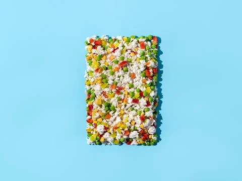 Frozen vegetables assorted on blue, top view Foto stock
