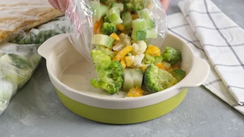 Frozen vegetables in a baking dish. Frozen food. Stock Footage 151162339