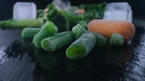 Frozen vegetables camera moving,cauliflower,carrots,peas,string beans,Concept of Stock Footage 130996602