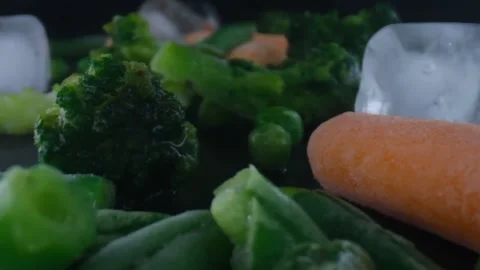Frozen vegetables camera moving,cauliflower,carrots,peas,string beans,Concept of Stock Footage 131606333