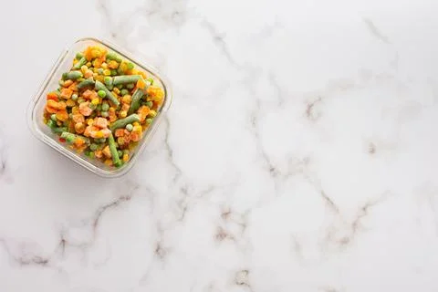 Frozen vegetables in container Stock Photos
