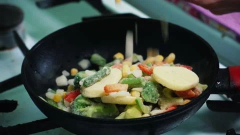 Frozen vegetables on a frying pan Stock Footage 197375642