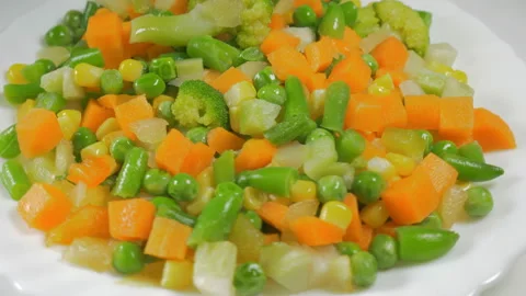Frozen vegetables, lettuce on a plate Stock Footage 88438593