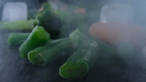 Frozen vegetables on table,cauliflower,carrots,peas,string beans,Concept of Stock Footage 131606128