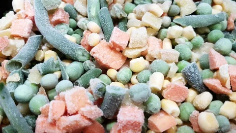 Frozen vegetables. Top view of assorted vegetables. Green beans, peas, carrots Video stock 128509056