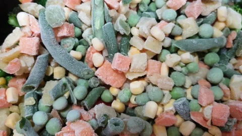 Frozen vegetables. Top view assorted vegetables. String beans, peas, carrots Stock Footage 129915343