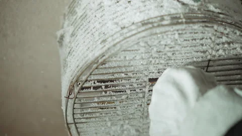 Frozen vent with field worker prying open grille, square access revealed 스톡 동영상 347079886
