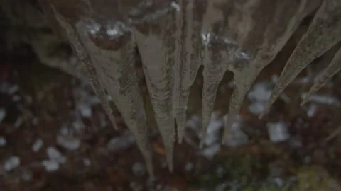 Frozen water dripping into icicles  Stock Footage 146266735