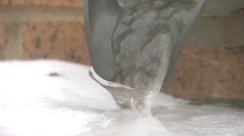 Frozen water from gutter system Stock Footage 1073793