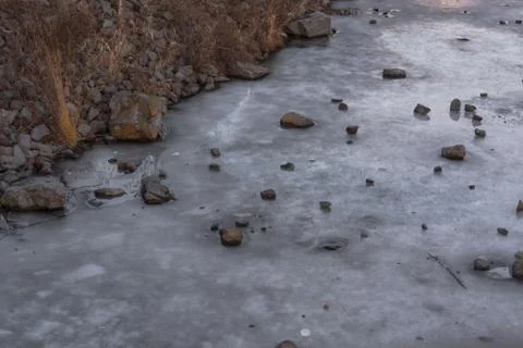 Frozen water surface of a river. Stock Photos