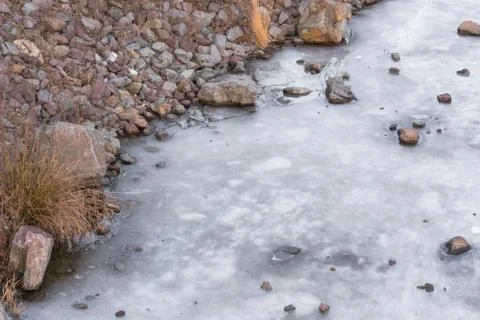 Frozen water surface of a river. Stock Photos