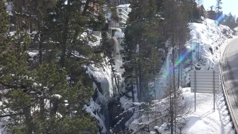 Frozen waterfall and mountain road in pontresina, Switzerland Stock-Footage 328809079