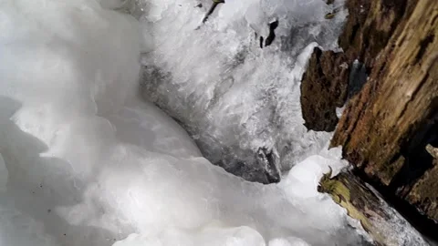 Frozen waterfall. Blocks of ice. small waterfall. Frozen forest stream. Stock Footage 171999909